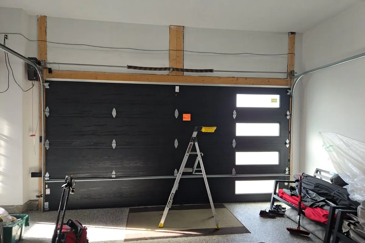 Established Bells Corners home with a modern black insulated double garage door